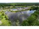 Community pool with waterfront views, clubhouse, and lounging areas at 16022 Westerham Dr, Tampa, FL 33647