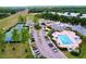 Community pool featuring a playground, parking, and a clubhouse at 16022 Westerham Dr, Tampa, FL 33647
