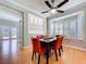 Open-concept dining room with a bay window and built-in display case at 16022 Westerham Dr, Tampa, FL 33647