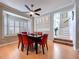 Elegant dining room with bay window, a display nook, and wood flooring at 16022 Westerham Dr, Tampa, FL 33647