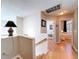 Upstairs hallway with wood floors leading to bedrooms at 16022 Westerham Dr, Tampa, FL 33647