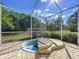 Hot tub in enclosed patio space at 16022 Westerham Dr, Tampa, FL 33647