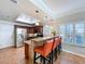 Kitchen bar with granite countertops, stainless appliances, and lots of natural light at 16022 Westerham Dr, Tampa, FL 33647