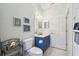 Bright bathroom featuring a vanity with storage, toilet, decorative accents, and a clean, modern design at 18109 Tiverton Ct, Hudson, FL 34667
