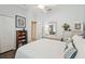 Inviting bedroom featuring a ceiling fan, ample natural light, and a comfortable bed for a peaceful retreat at 18109 Tiverton Ct, Hudson, FL 34667