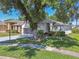 Charming single-story home featuring well-manicured lawn and mature trees in a desirable community at 18109 Tiverton Ct, Hudson, FL 34667