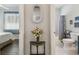 Charming hallway connecting the bedroom and bathroom, adorned with decorative details and a welcoming ambiance at 18109 Tiverton Ct, Hudson, FL 34667