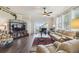Inviting living room with hardwood floors, comfortable seating, and a view of the outdoor area at 18109 Tiverton Ct, Hudson, FL 34667