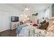Serene main bedroom with white wicker furniture, a ceiling fan, and a queen-sized bed at 18109 Tiverton Ct, Hudson, FL 34667
