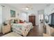 Light and airy main bedroom with ceiling fan, ample closet space, and wood-look floors at 18109 Tiverton Ct, Hudson, FL 34667