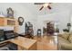 Bright office with wood floors, a desk, and a view into the dining room at 18109 Tiverton Ct, Hudson, FL 34667