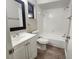 Bathroom featuring modern fixtures, a sleek vanity, and a tiled shower-tub combo at 18232 Monteverde Dr, Spring Hill, FL 34610