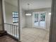 Inviting dining area features tile floors, modern lighting, and French doors to the outdoors at 18232 Monteverde Dr, Spring Hill, FL 34610