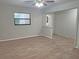 Comfortable living space with updated flooring, natural light, and view to adjacent area at 18232 Monteverde Dr, Spring Hill, FL 34610