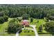 Expansive property featuring a well-maintained home with lush landscaping and surrounding natural beauty at 22106 Garmisch Way, Brooksville, FL 34601