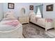 Bedroom features two twin beds, white furniture, decor, neutral paint and carpeted floors at 22106 Garmisch Way, Brooksville, FL 34601