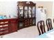 Dining room features decor, furniture, china cabinet and natural light through large windows at 22106 Garmisch Way, Brooksville, FL 34601