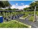 The lush garden is full of vertical planters, raised beds, and is enclosed with a metal fence at 22106 Garmisch Way, Brooksville, FL 34601