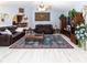 Spacious living room boasts wood-look flooring, two leather couches, and open floor plan at 22106 Garmisch Way, Brooksville, FL 34601