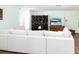 Spacious living room with a view of the backyard pool from the television at 22106 Garmisch Way, Brooksville, FL 34601