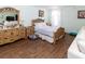 Comfortable bedroom with decorative wood headboard and matching nightstands at 22106 Garmisch Way, Brooksville, FL 34601