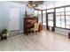 Sunroom features tile floors, piano, and access to the pool area at 22106 Garmisch Way, Brooksville, FL 34601
