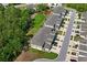 An aerial view of modern townhomes, surrounded by green spaces and well maintained landscaping at 3032 Jacob Crossing Ln, Holiday, FL 34691