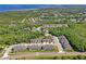 Aerial view of community near a body of water showing surrounding landscape and neighborhood layout at 3032 Jacob Crossing Ln, Holiday, FL 34691