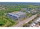 An aerial view of a large commercial building with ample parking and surrounding landscaping at 3032 Jacob Crossing Ln, Holiday, FL 34691
