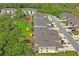 Aerial view showing homes near a playground, dog park and mature trees at 3032 Jacob Crossing Ln, Holiday, FL 34691