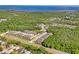 Aerial view of community, close to the ocean, lush greenery, and well-maintained properties at 3032 Jacob Crossing Ln, Holiday, FL 34691