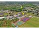 An aerial view of a park with tennis courts, baseball and soccer fields, near a parking lot at 3032 Jacob Crossing Ln, Holiday, FL 34691