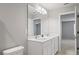 Bright bathroom with double sinks, large mirror, and ample lighting at 3032 Jacob Crossing Ln, Holiday, FL 34691