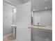 Bathroom with pedestal sink and granite countertop conveniently located next to the kitchen at 3032 Jacob Crossing Ln, Holiday, FL 34691