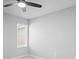 Bright bedroom with a ceiling fan and a window letting in natural light, and neutral color scheme at 3032 Jacob Crossing Ln, Holiday, FL 34691