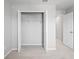 A walk-in closet features double doors, wire shelving for optimal storage space, and plush carpet flooring at 3032 Jacob Crossing Ln, Holiday, FL 34691