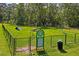 Well-maintained dog park with agility equipment, picnic table, and secure fencing at 3032 Jacob Crossing Ln, Holiday, FL 34691