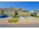 Townhome exteriors boast colorful exteriors, attached garages and manicured front lawns at 3032 Jacob Crossing Ln, Holiday, FL 34691