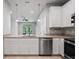 Modern kitchen with granite countertops, stainless steel appliances, and ample cabinet space at 3032 Jacob Crossing Ln, Holiday, FL 34691