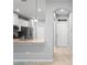 Open-concept kitchen featuring white cabinets, granite countertops, and stainless steel appliances at 3032 Jacob Crossing Ln, Holiday, FL 34691