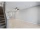 Open-concept living room with neutral walls, tile flooring, recessed lighting, and a ceiling fan at 3032 Jacob Crossing Ln, Holiday, FL 34691