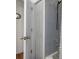 Bathroom with a shower and tub featuring gray tiling and bronze fixtures at 3345 Carmen Ave, Spring Hill, FL 34609