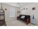 Spare bedroom featuring a futon, window, and unique wall decor at 3345 Carmen Ave, Spring Hill, FL 34609