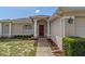 Charming single-story home with a well-manicured lawn, classic architectural details, and an attached two-car garage at 3345 Carmen Ave, Spring Hill, FL 34609