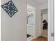Hallway showing an open bathroom and bedroom with a light blue sink and cherry furniture at 3345 Carmen Ave, Spring Hill, FL 34609