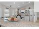 Bright kitchen features granite countertops, stainless steel appliances, and a kitchen island at 3345 Carmen Ave, Spring Hill, FL 34609
