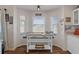 Bright breakfast nook features a granite countertop island and natural light at 3345 Carmen Ave, Spring Hill, FL 34609