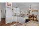 Bright kitchen features white cabinetry, stainless steel appliances, and hardwood floors at 3345 Carmen Ave, Spring Hill, FL 34609
