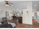 Inviting living room featuring wood floors, neutral paint, stylish decor, and a ceiling fan at 3345 Carmen Ave, Spring Hill, FL 34609