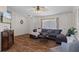 Inviting living room featuring wood floors, neutral paint, stylish decor, and a ceiling fan at 3345 Carmen Ave, Spring Hill, FL 34609